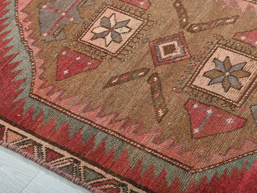a close up of a rug on a wooden floor