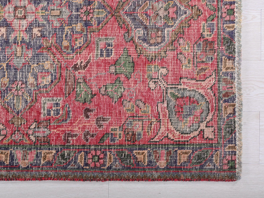 a pink rug with a floral design on it