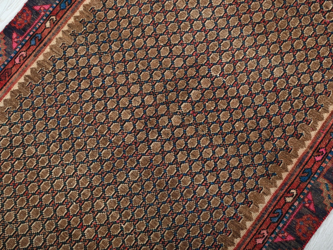 a close up of a rug on a wooden floor