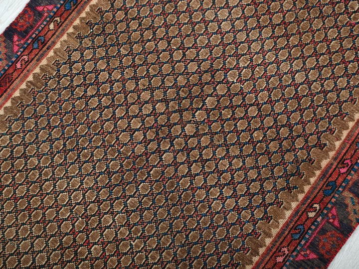 a close up of a rug on a wooden floor
