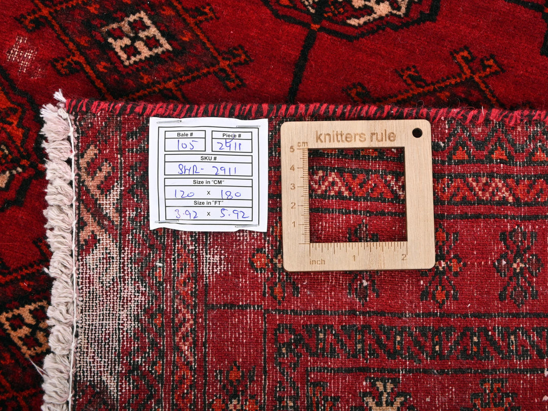 a picture frame on a rug with a ruler