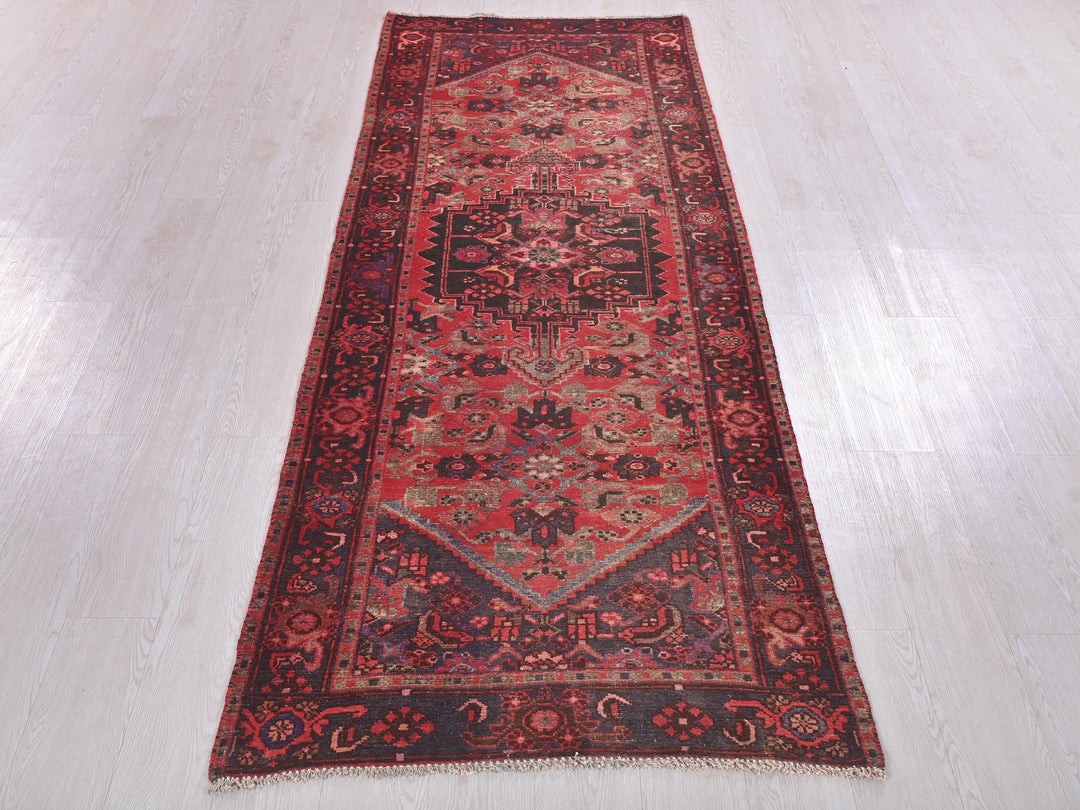 a red rug on a white floor in a room