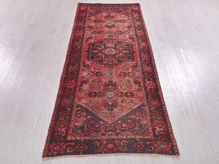 a red rug on a white floor in a room