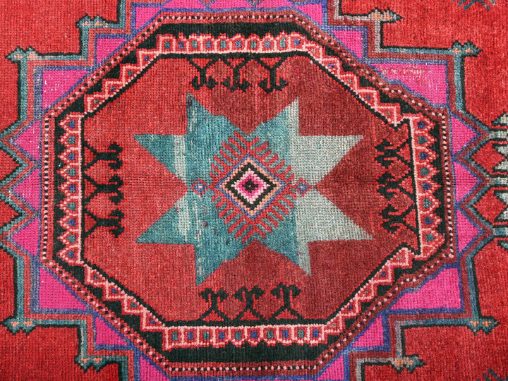 a close up of a rug with a star design on it