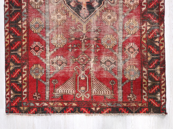 a red rug with a picture of a woman on it