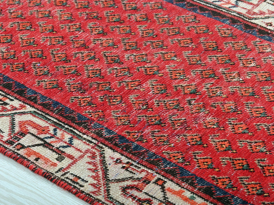 a close up of a rug on a wooden floor