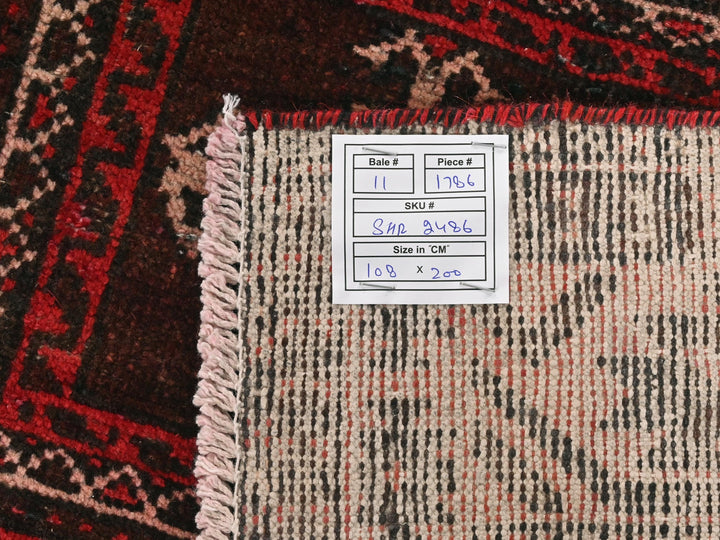 a pile of rugs with a price label on them