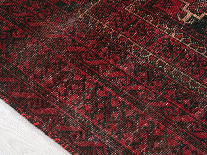 a close up of a rug on a wooden floor