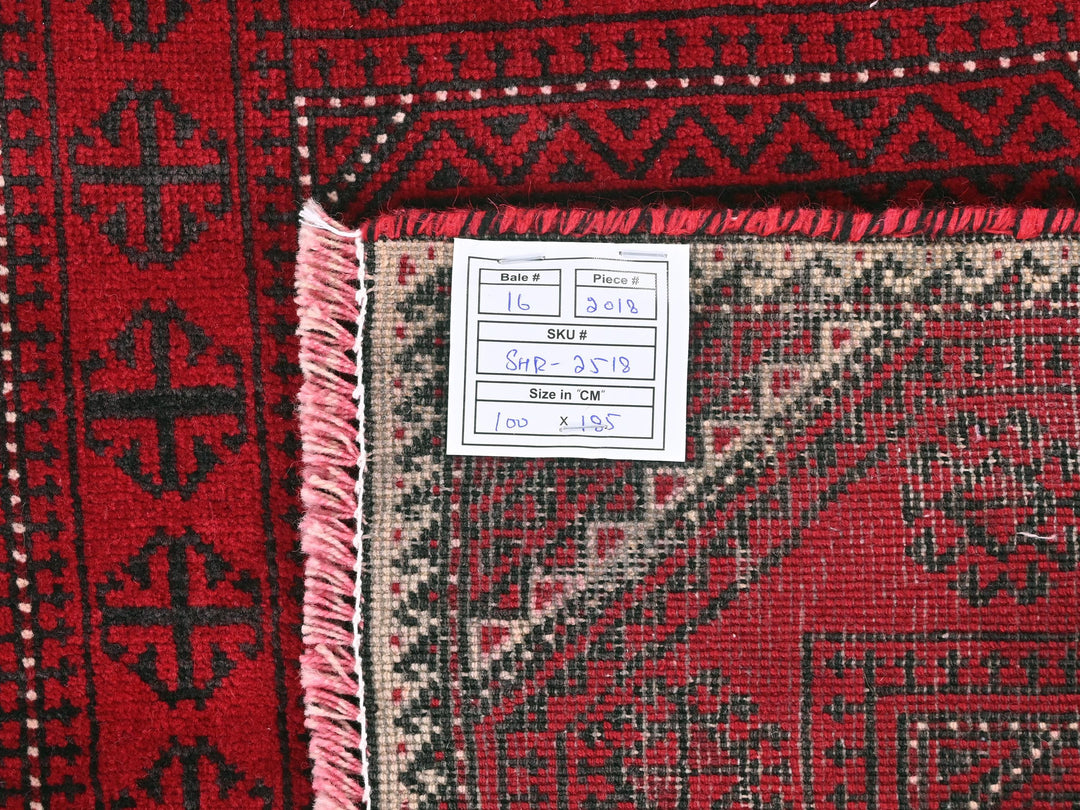 a red rug with a tag on it