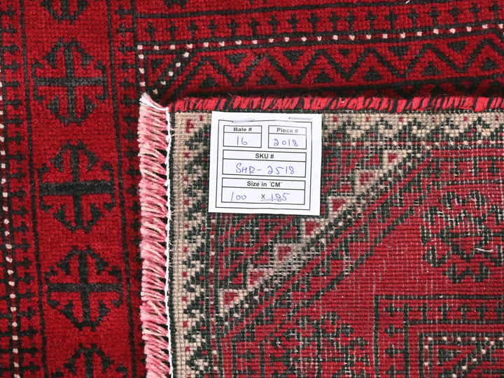 a red rug with a tag on it
