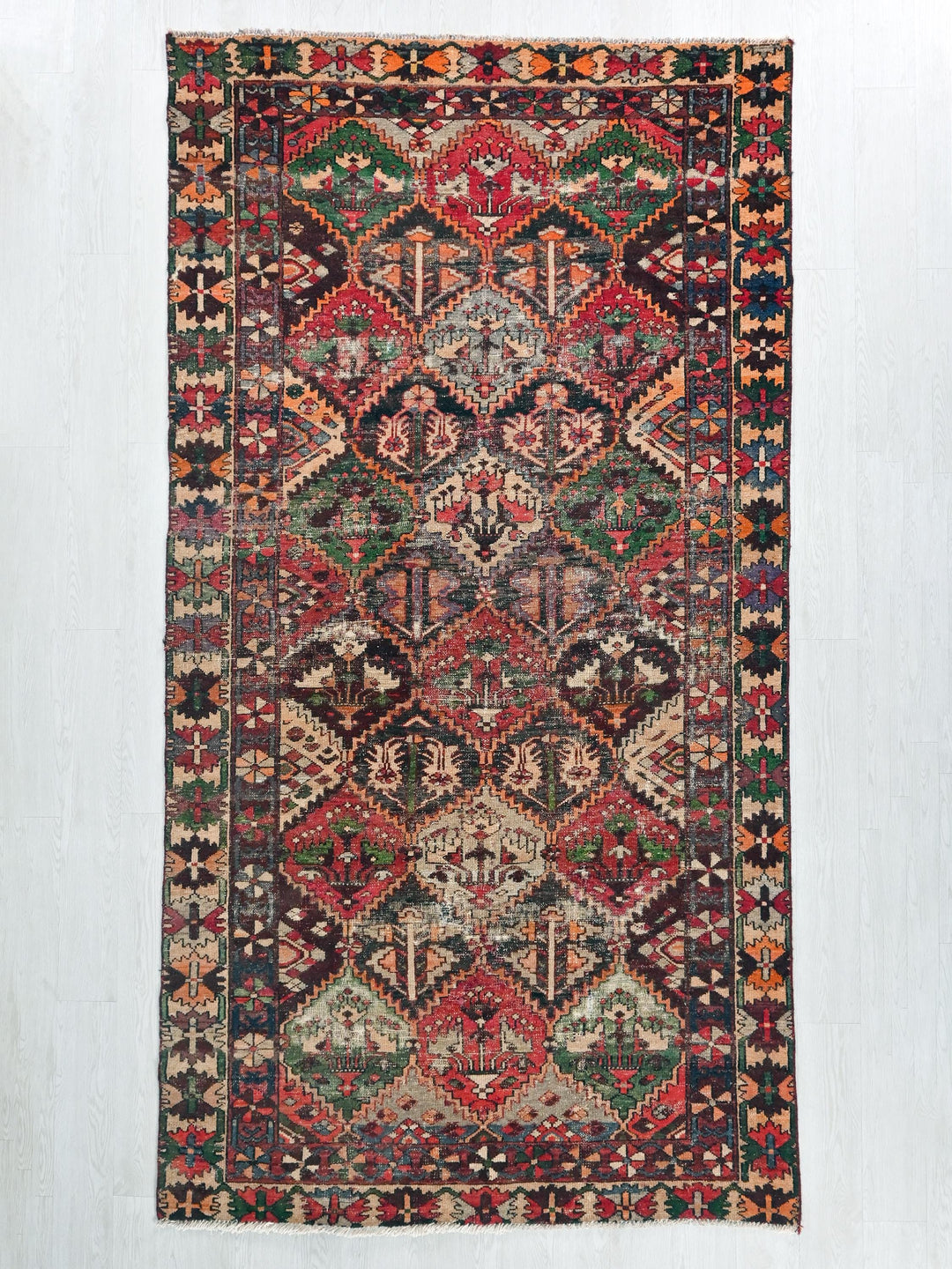 a colorful rug hanging on a wall
