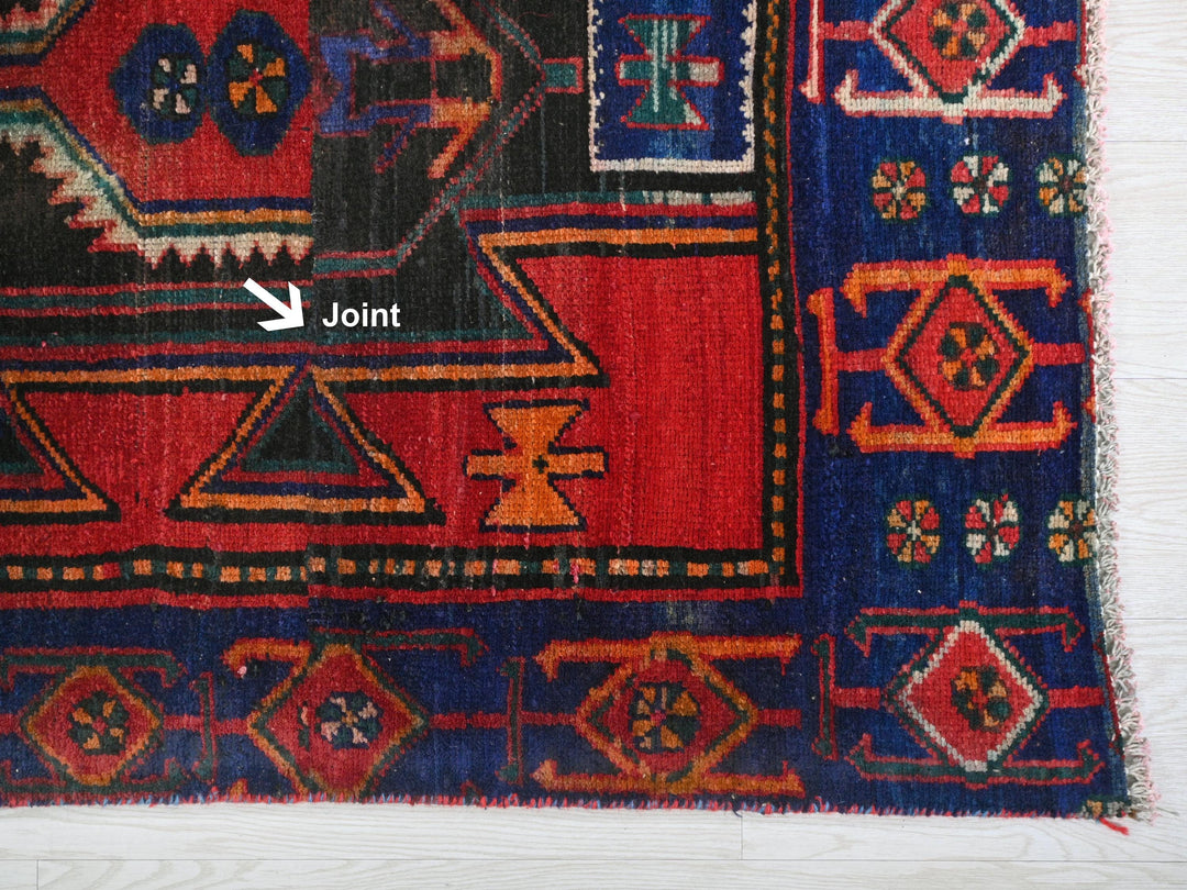 a close up of a rug on a wooden floor