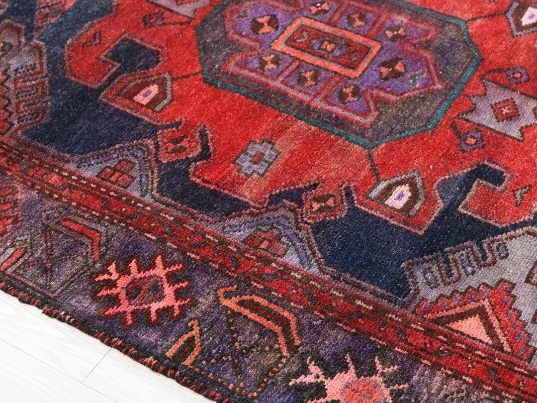a close up of a rug on a wooden floor