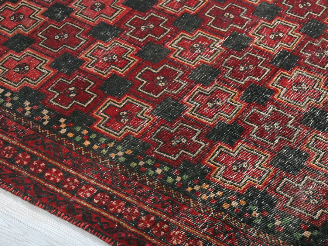 a close up of a rug on a wooden floor