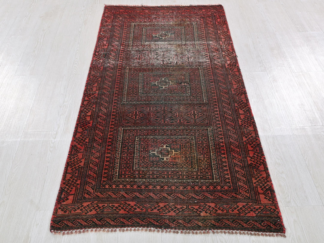 a red rug on a white floor in a room