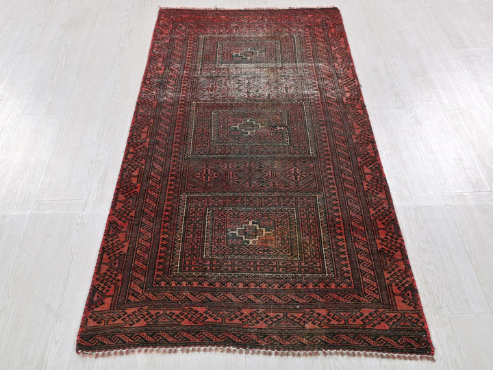 a red rug on a white floor in a room