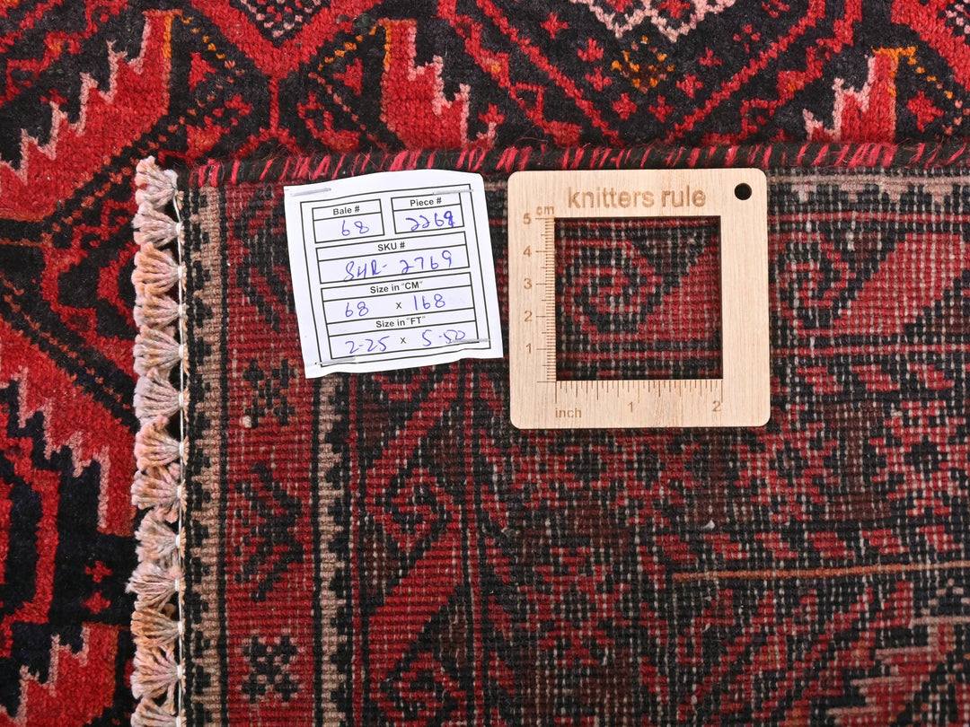 a piece of wood sitting on top of a rug