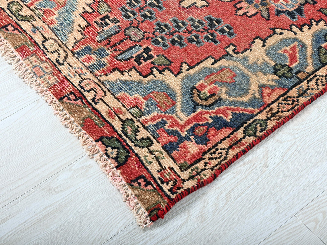 a rug with a red and blue design on it