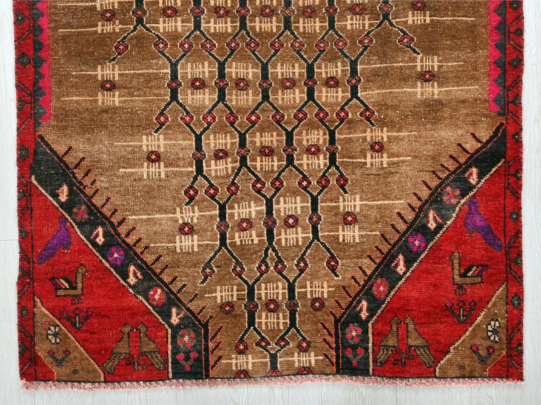 a brown and red rug with designs on it
