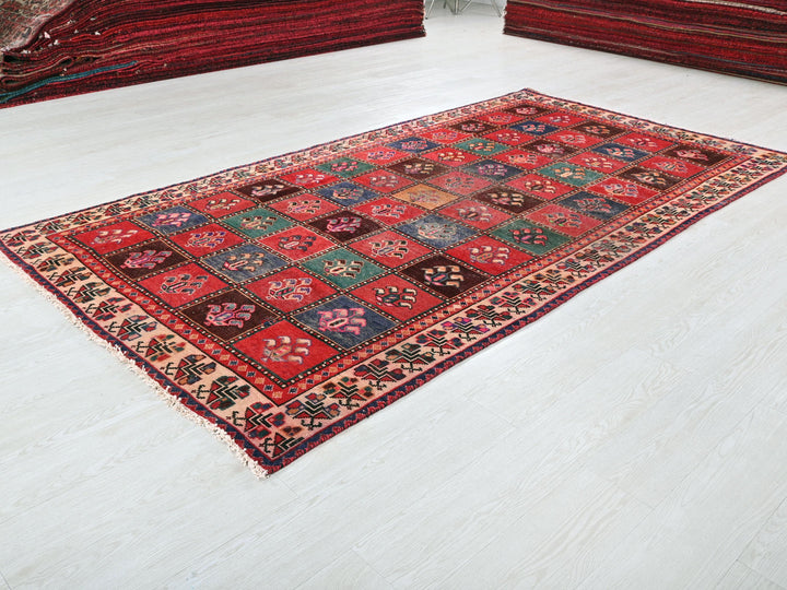 a red rug on the floor of a room