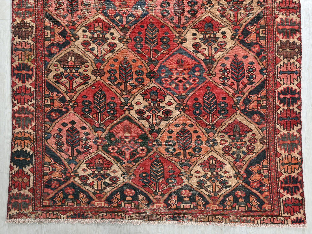 a red and blue rug on a white wall