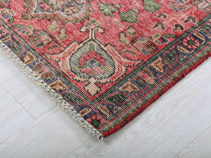 a close up of a rug on a wooden floor
