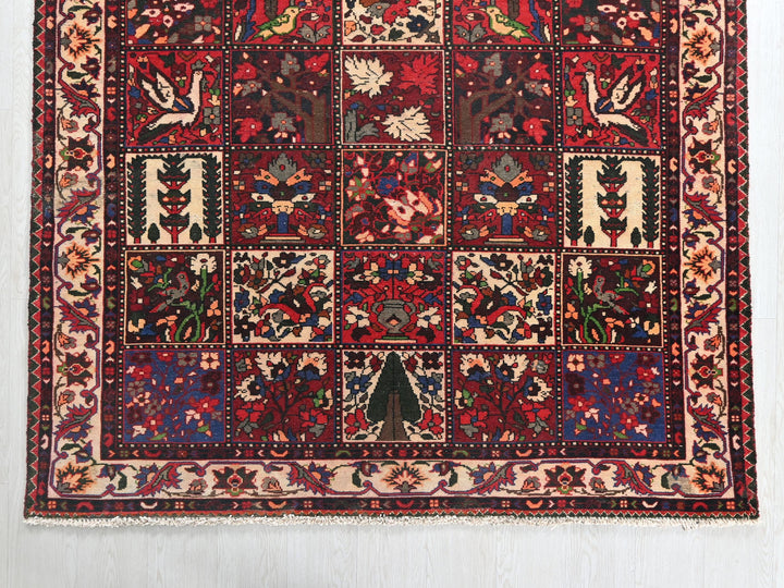 a red rug with a patchwork design on it