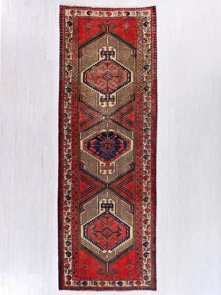 a rug hanging on a wall in a room