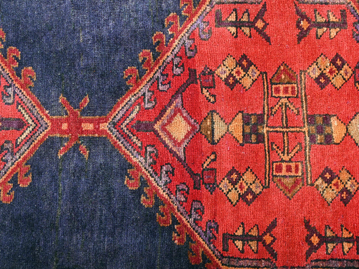 a close up of a red and blue rug