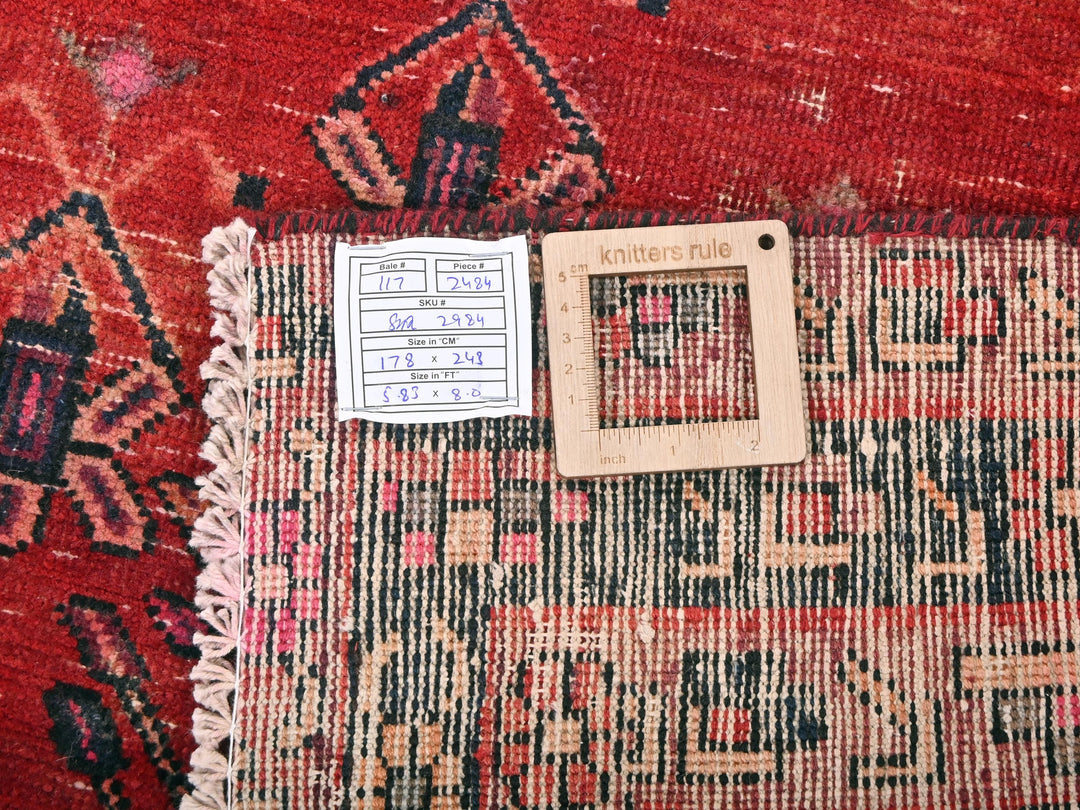 a piece of wood sitting on top of a rug