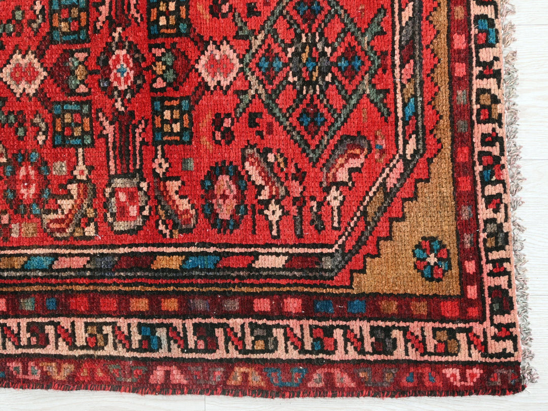 a close up of a rug on a white surface