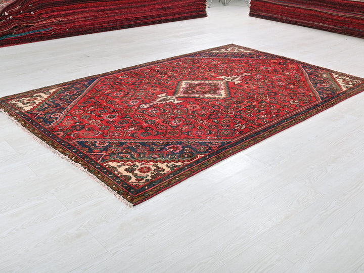 a red rug on the floor of a room