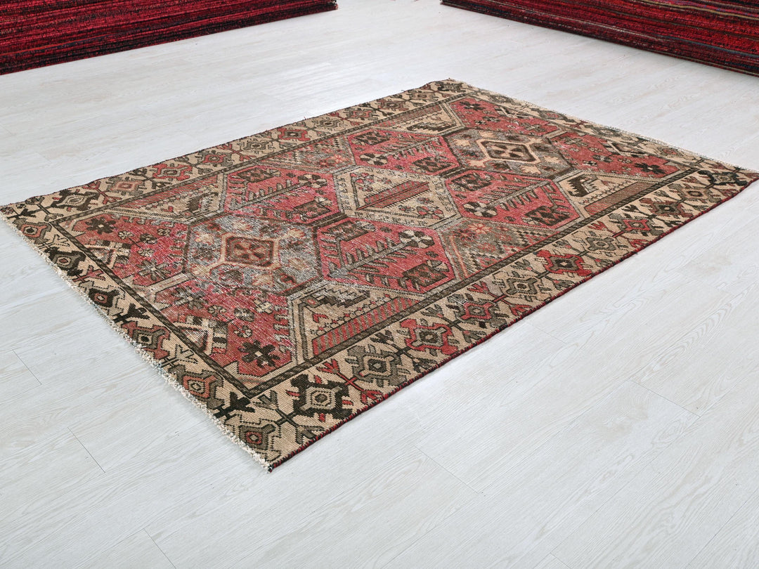 a red rug on the floor of a room