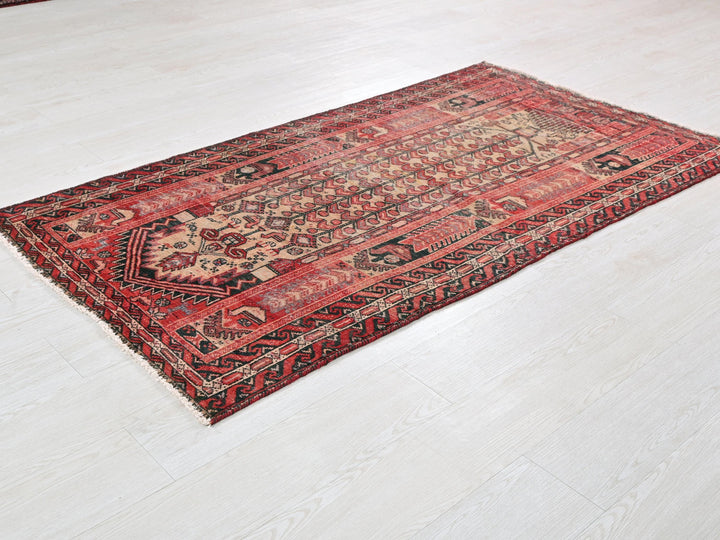 a red rug on a white floor in a room