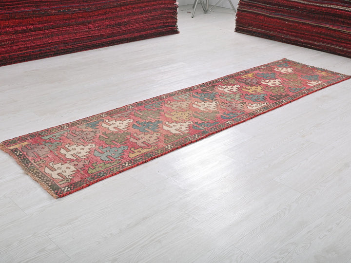 a rug is laying on the floor next to a pile of rugs