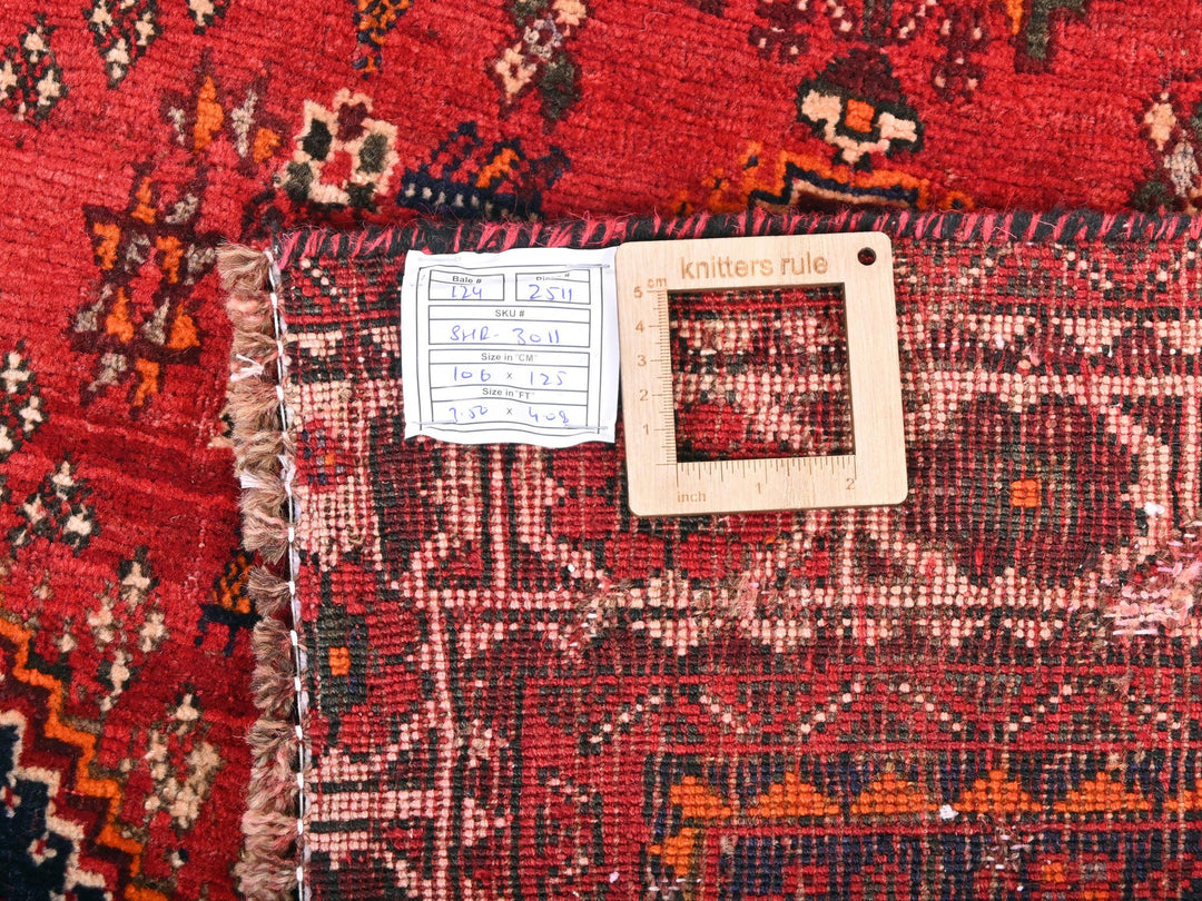 a piece of paper on a rug with a tag on it