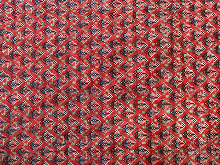 a close up of a red, black, and white cloth