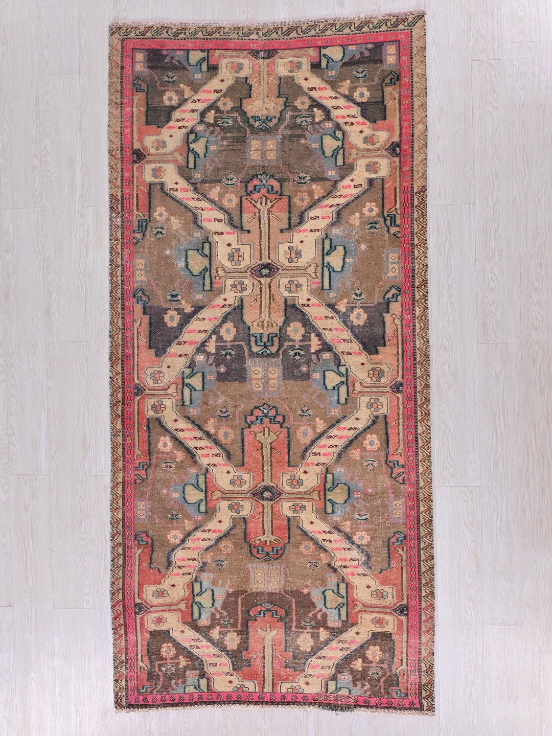 a rug hanging on a wall in a room