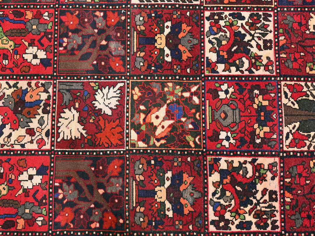 a red rug with many different designs on it