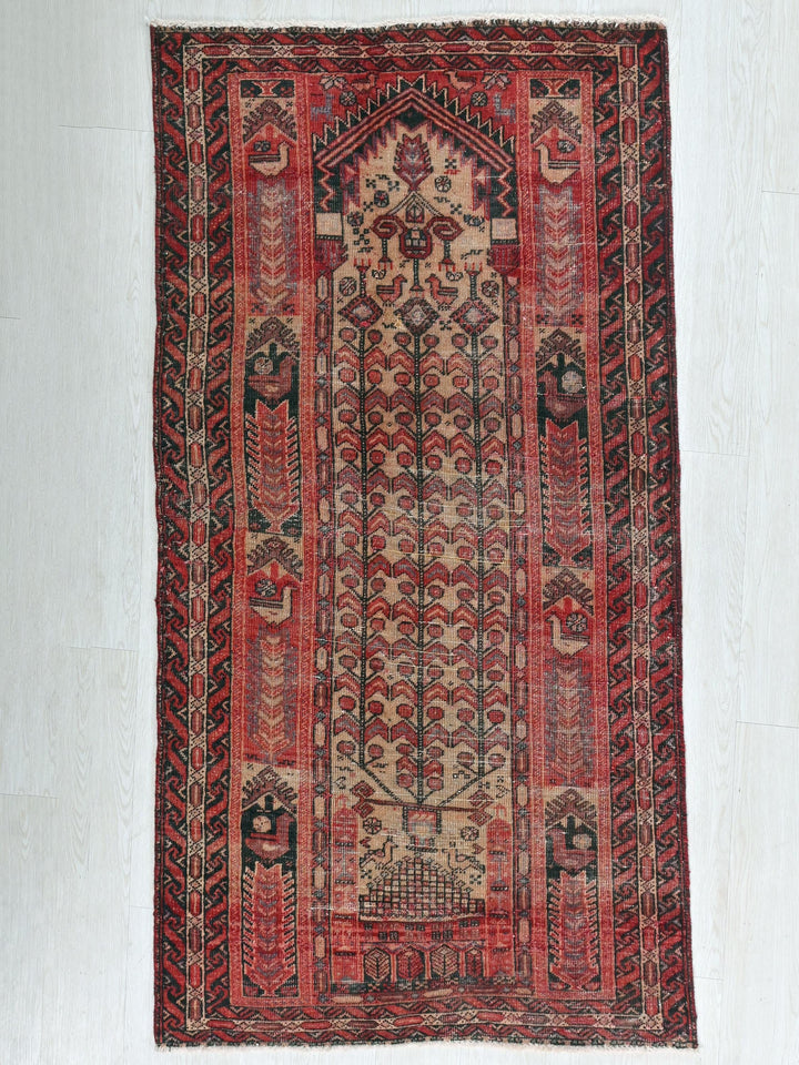 a red and black rug with elephants on it