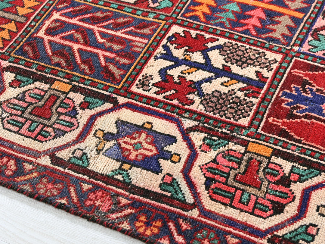 a multicolored oriental rug on a white wooden floor