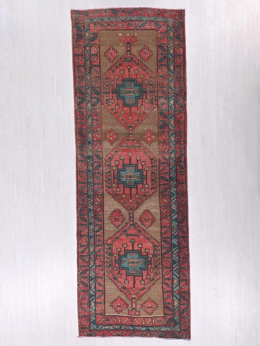 a rug hanging on a wall in a room