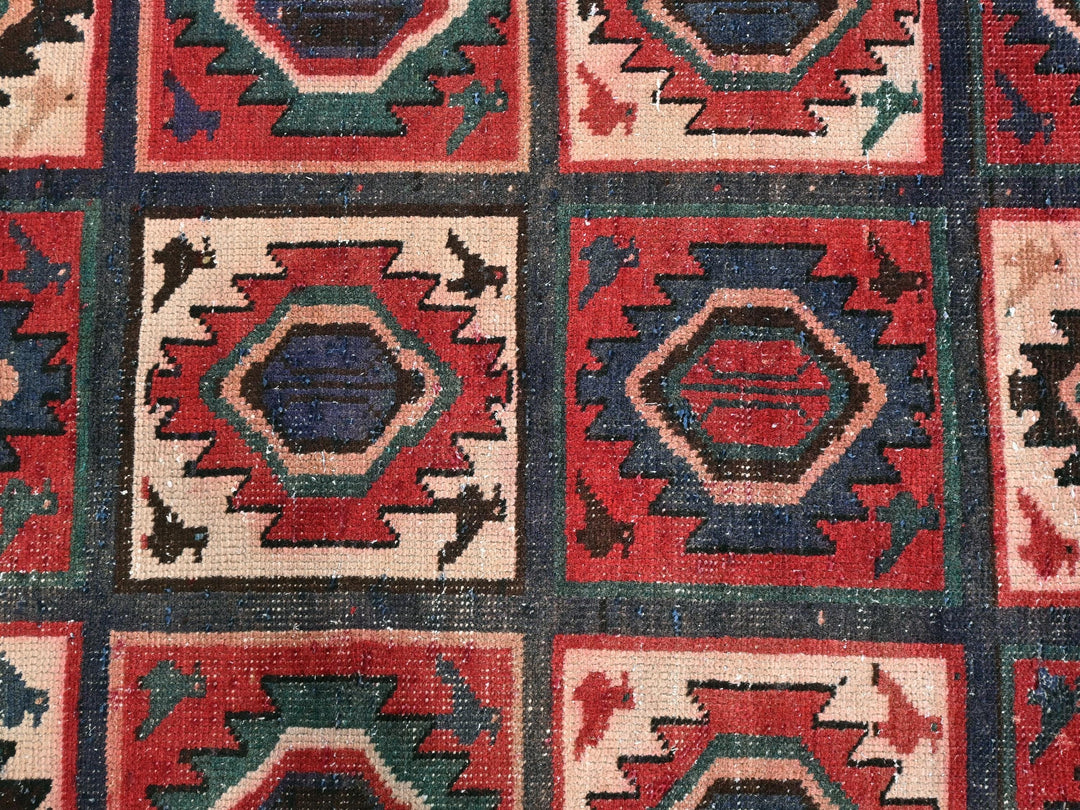 a multicolored area rug with a design on it