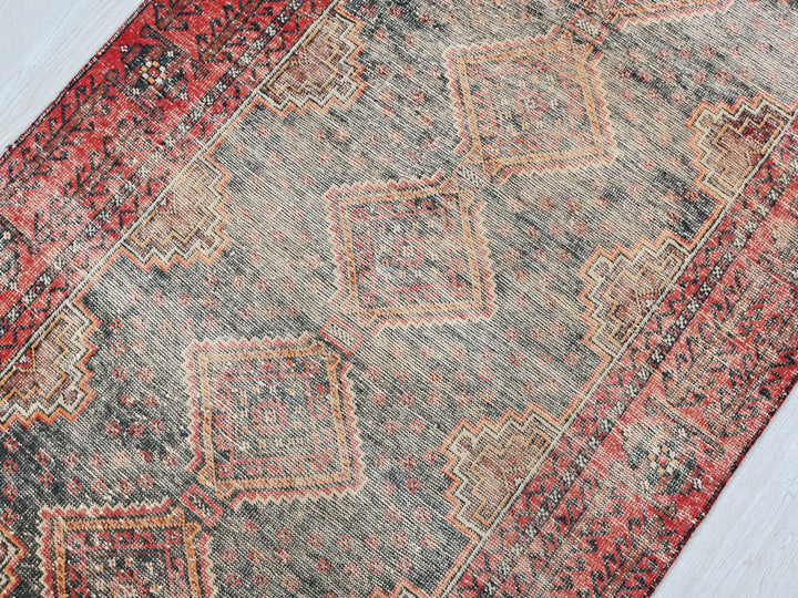 a rug with a red and blue design on it