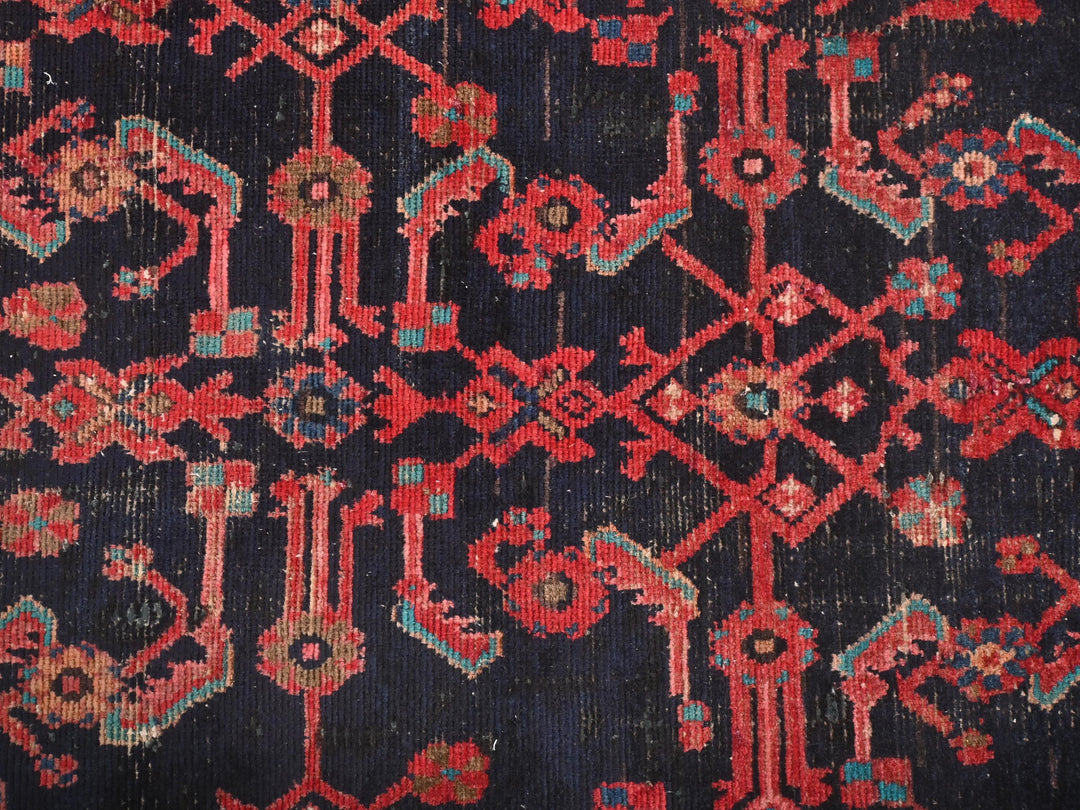 a close up of a red and blue rug