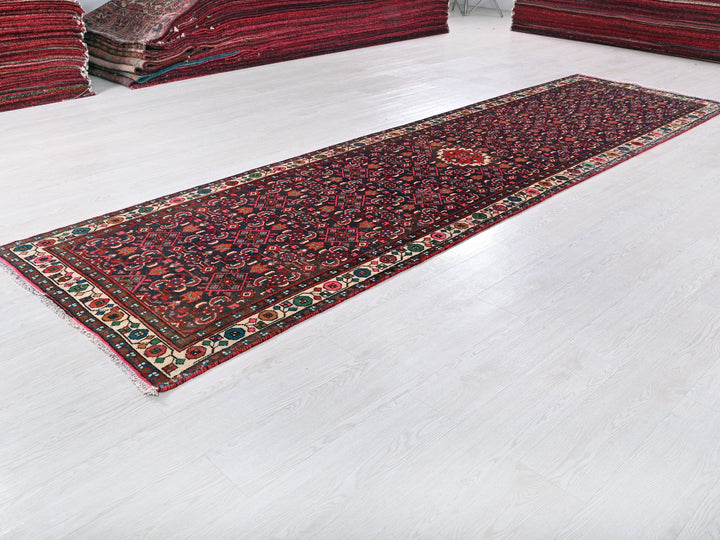 a rug is laying on the floor next to a pile of rugs