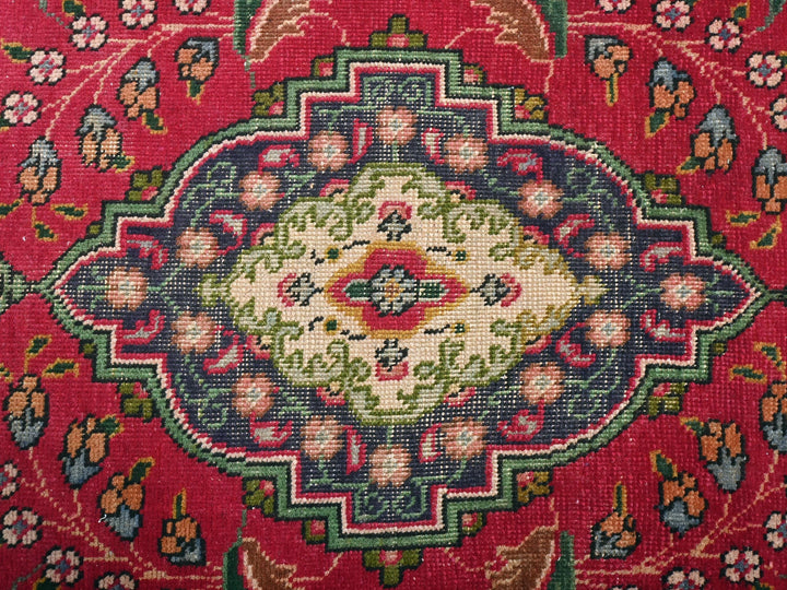a close up of a rug with a red background