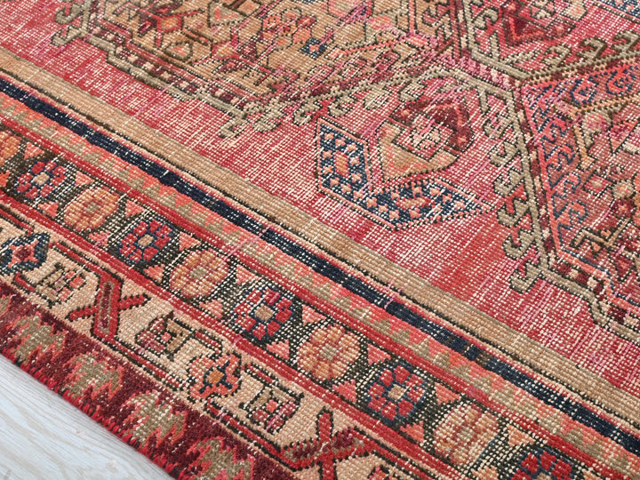 a close up of a rug with a wooden floor