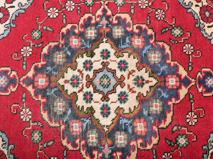 a close up of a red oriental rug