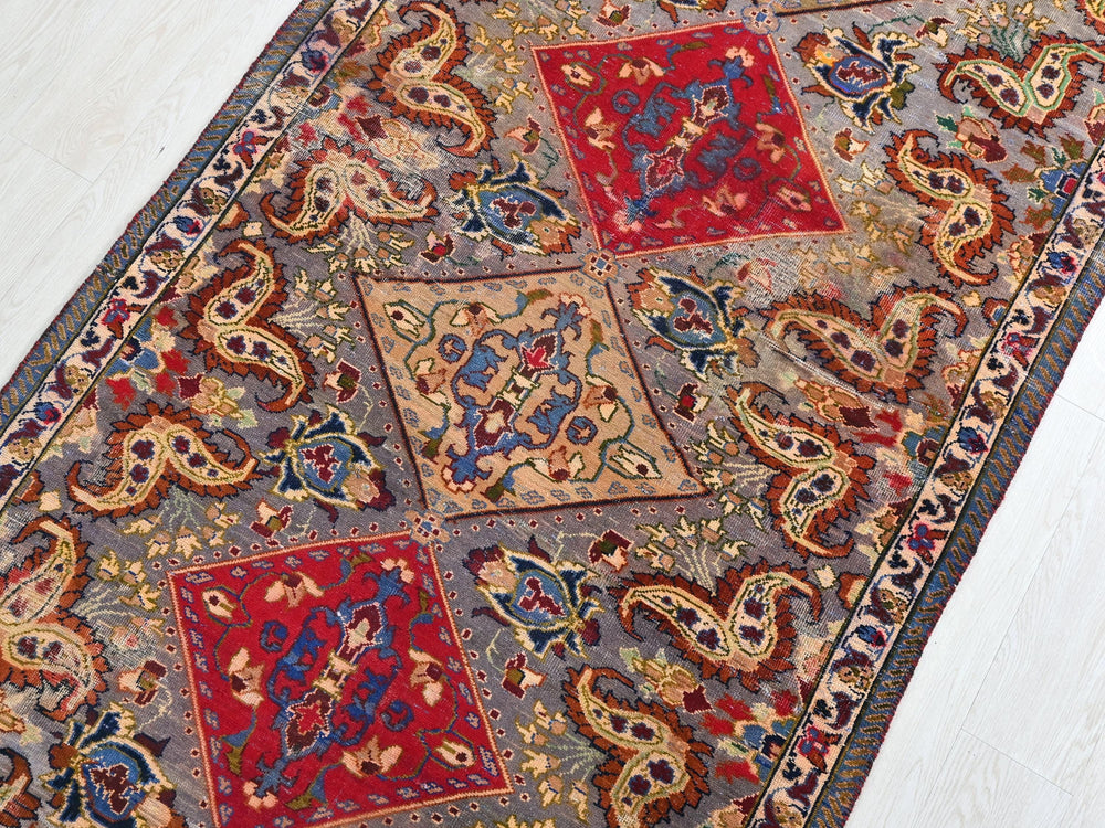 a rug with a colorful design on the floor